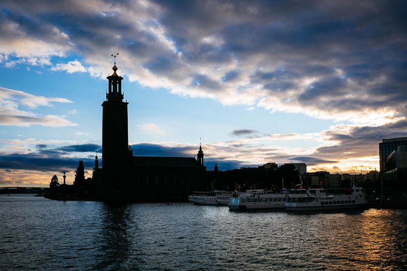 Stockholms stadshus, the City Hall of Stockholm, in the late evening with the sun setting in the west.