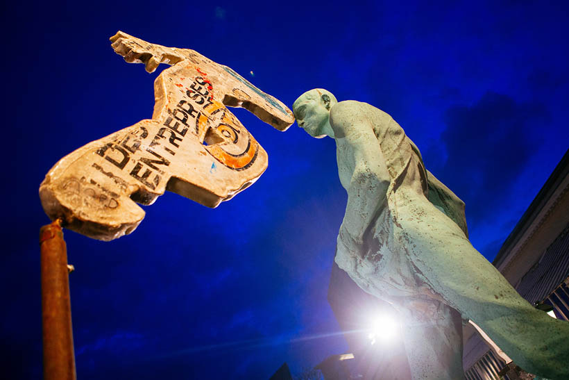 An art installation set up right in front of an existing statue in the gardens of the Botanique during Les Nuits Botanique.