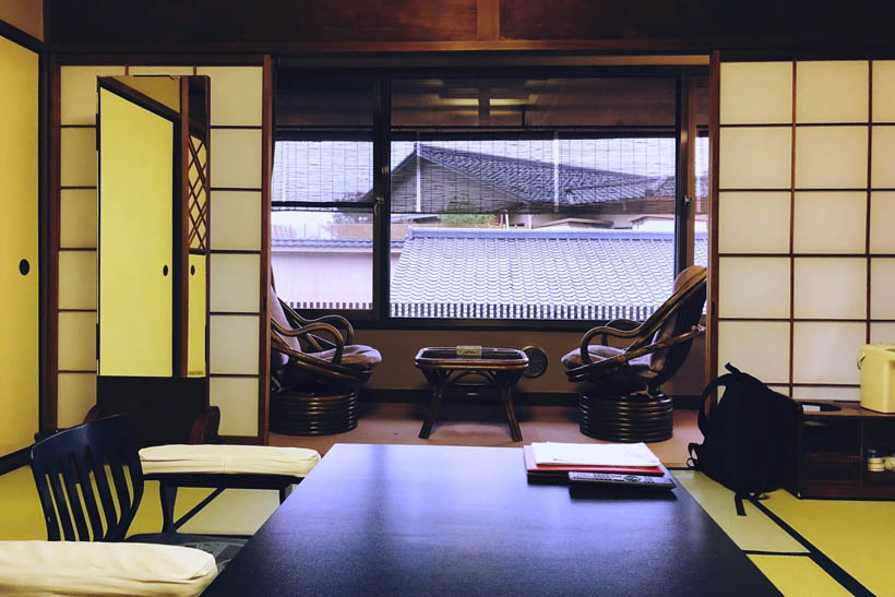 A room in a ryokan in Kyoto (Japan) with tatami flooring, a chabudai (a short table) and fusuma (sliding doors made from wood and paper).