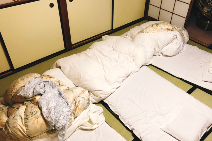 Futons on a tatami floor in a ryokan in Kyoto, Japan.