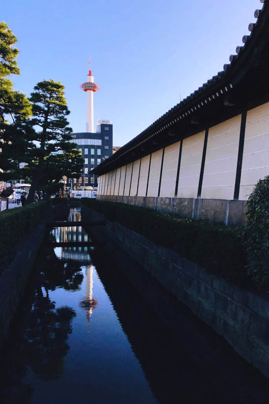 Kyoto Tower on a sunny day, as seen from the moat at Higashi Honganji temple.
