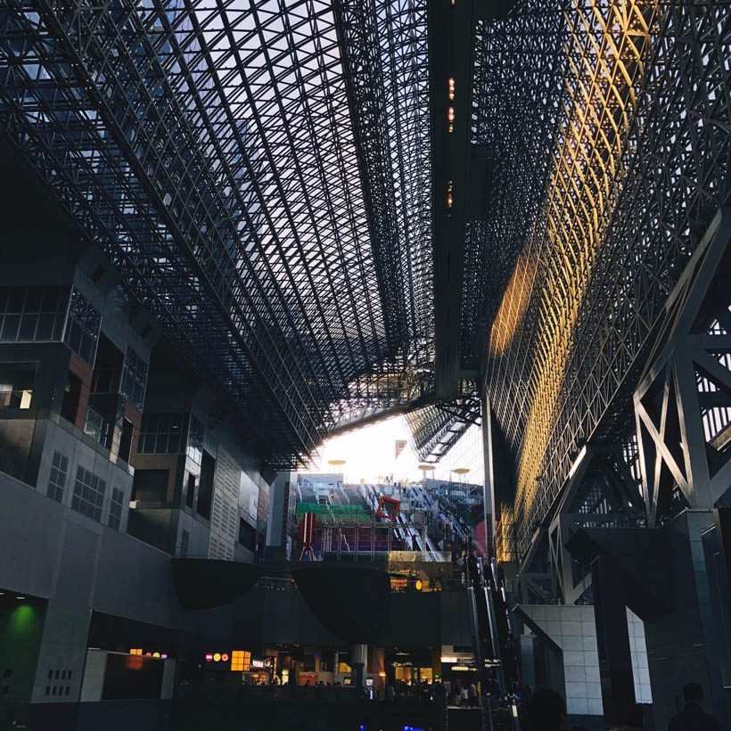 The main hall of Kyoto station in the afternoon, when the low sun hits the interior inside.