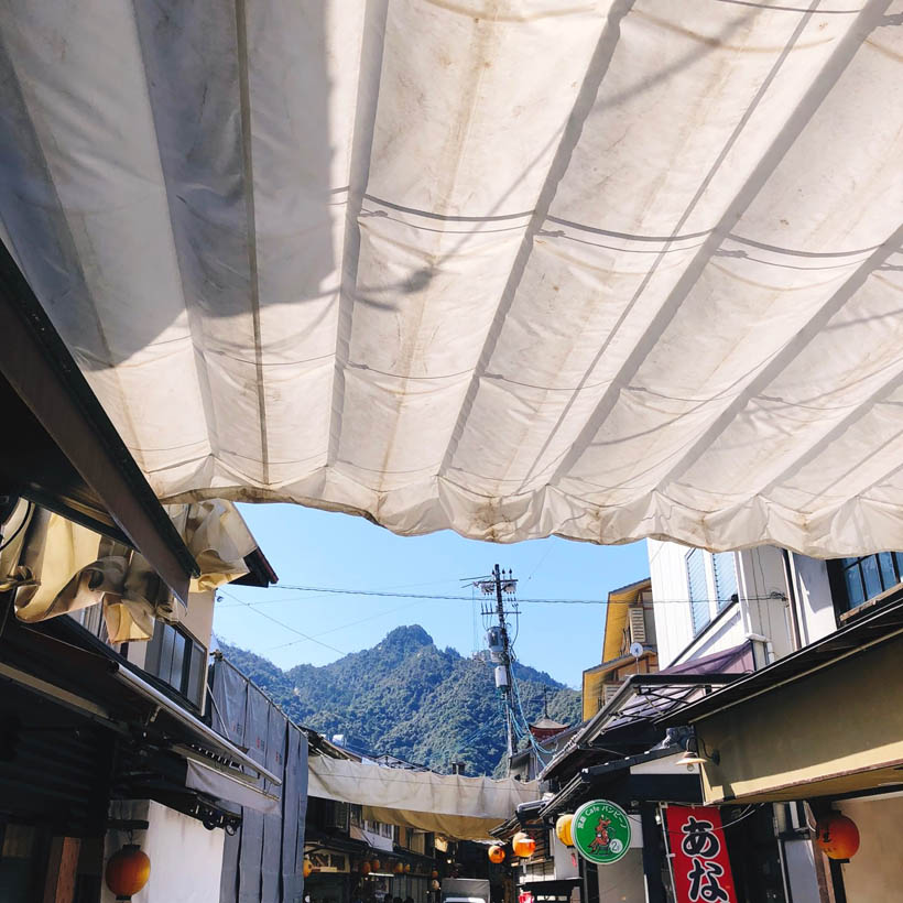 Looking at the mountain peaks from the busy shopping streets in Miyajima.
