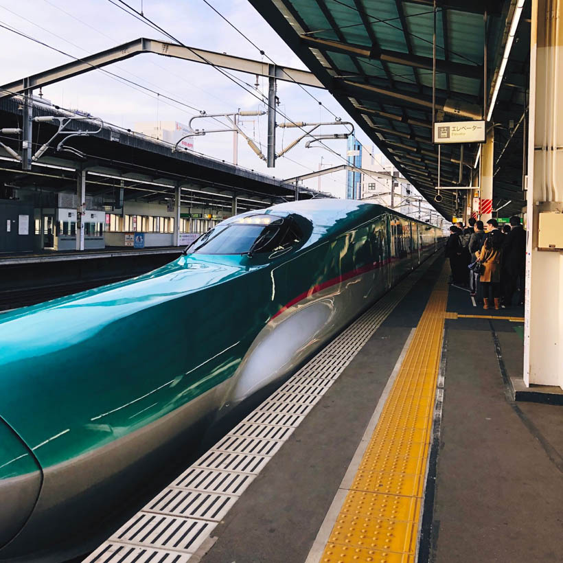 The Shinkansen train arriving at Utsonomiya station, on it's way to Tokyo, Japan.