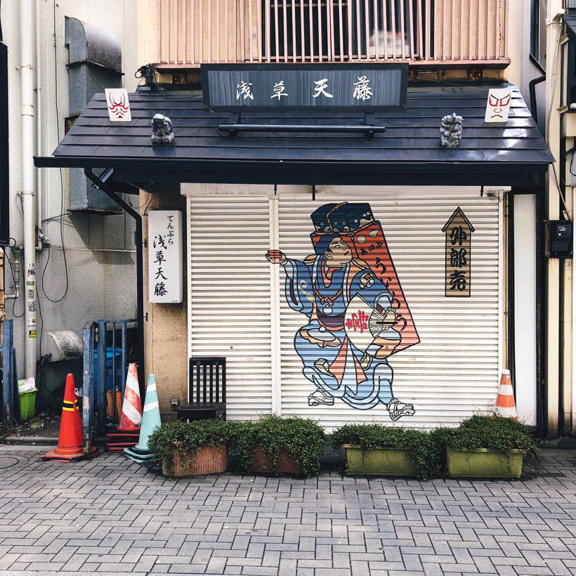A traditional inspired painting on one of the shutters of a store in the area of the Senso-ji temple in Tokyo, Japan.