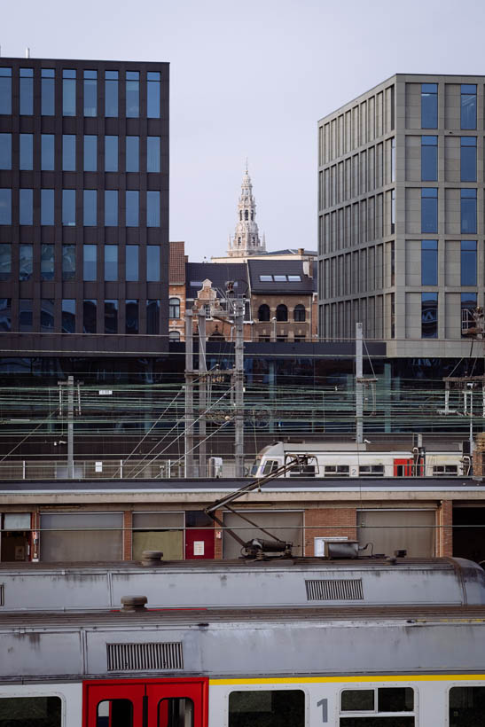 The central University Library of Leuven, with trains in the foreground.