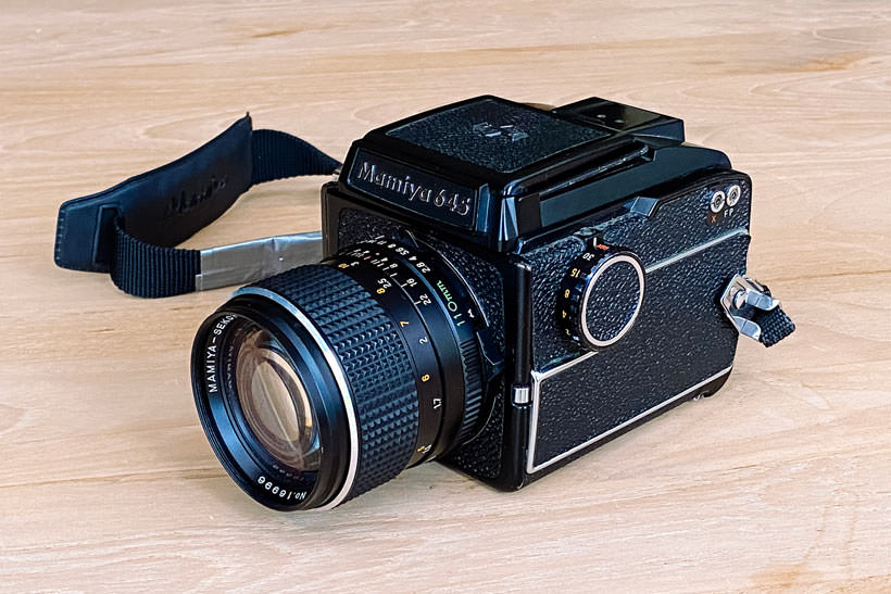 A Mamiya 645 (original model) medium format camera with a Sekor 110mm f/2.8 lens.