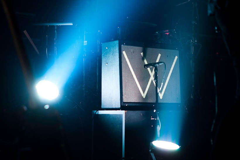 A guitar amplifier with the letter W taped on the front at a Man Without Country concert in Brussels, Belgium.